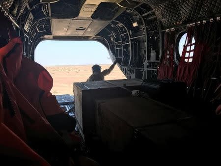 A soldier from the United Arab Emirates watches over Yemen's southern territory on a Chinook helicopter April 23, 2017. Picture taken April 23, 2017. REUTERS/Aziz El Yaakoubi