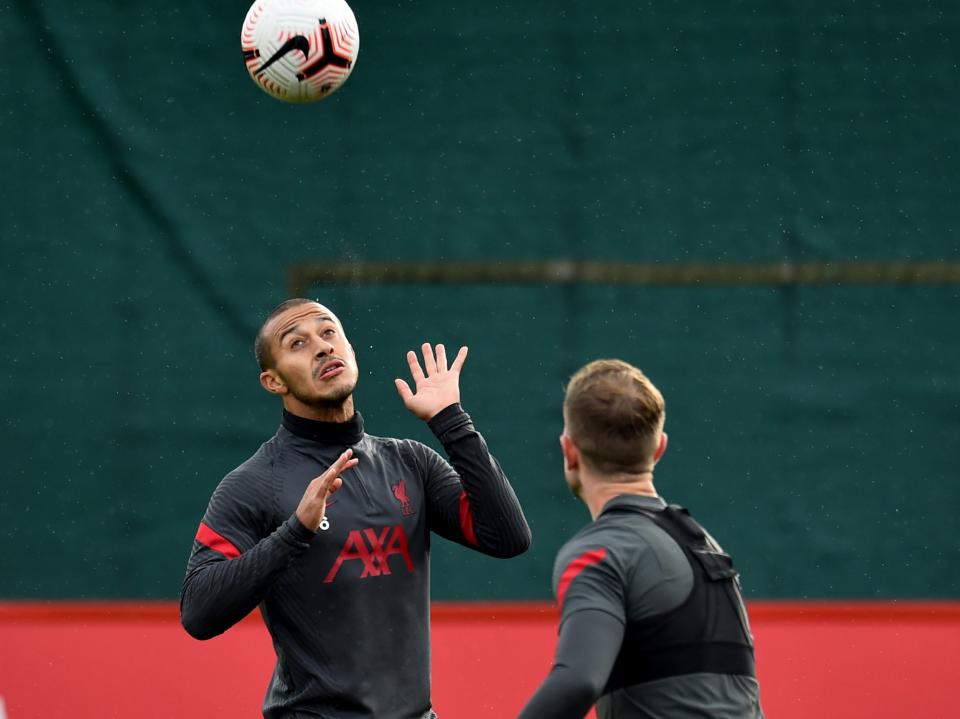 Liverpool captain Jordan Henderson (right) training with fellow midfielder ThiagoLiverpool FC via Getty Images