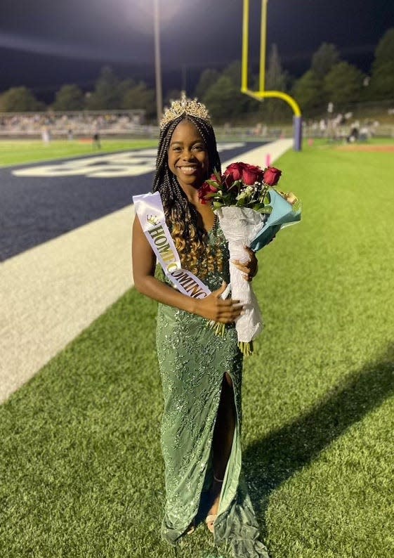 Jayla Miller poses for a photo after being honored as Independence High School's first Black homecoming queen.