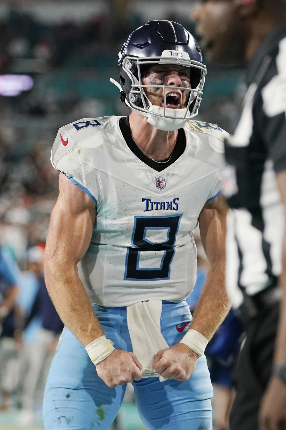 Tennessee Titans quarterback Will Levis (8) reacts after running back Derrick Henry scores a touchdown to tie the game during the second half of an NFL football game against the Miami Dolphins, Monday, Dec. 11, 2023, in Miami. (AP Photo/Lynne Sladky)