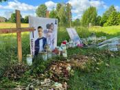 Flowers and other objects are placed at a memorial site for young men shot dead in the suburb of Varberga in May