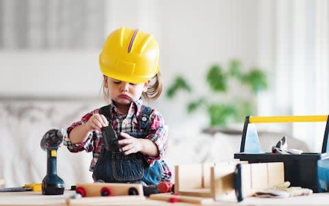 Litte 2 years old girl who dreams of becoming a carpenter - Credit: lisegagne/E+