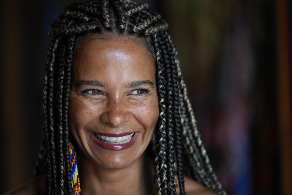 Raquel Potí smiles during an interview at her home in Rio de Janeiro, Brazil, Saturday, Jan. 27, 2024. Potí is chiefly responsible for the explosion of stilt walking in Rio, having trained more than 1,000 kids and adults over the past decade. (AP Photo/Silvia Izquierdo)