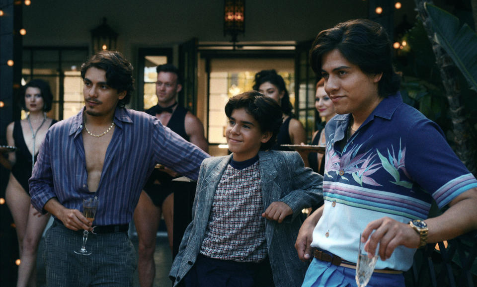 three men (griselda's sons in the netflix miniseries) stand together in front of several servers