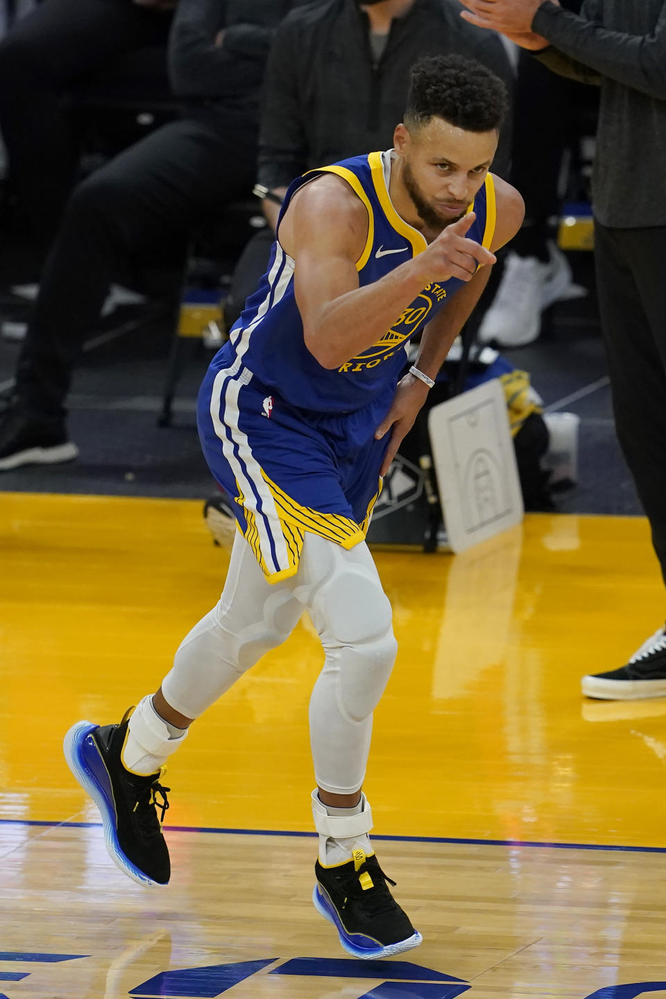 Golden State Warriors guard Stephen Curry reacts after scoring against the Cleveland Cavaliers during the second half of an NBA basketball game in San Francisco, Monday, Feb. 15, 2021. (AP Photo/Jeff Chiu)