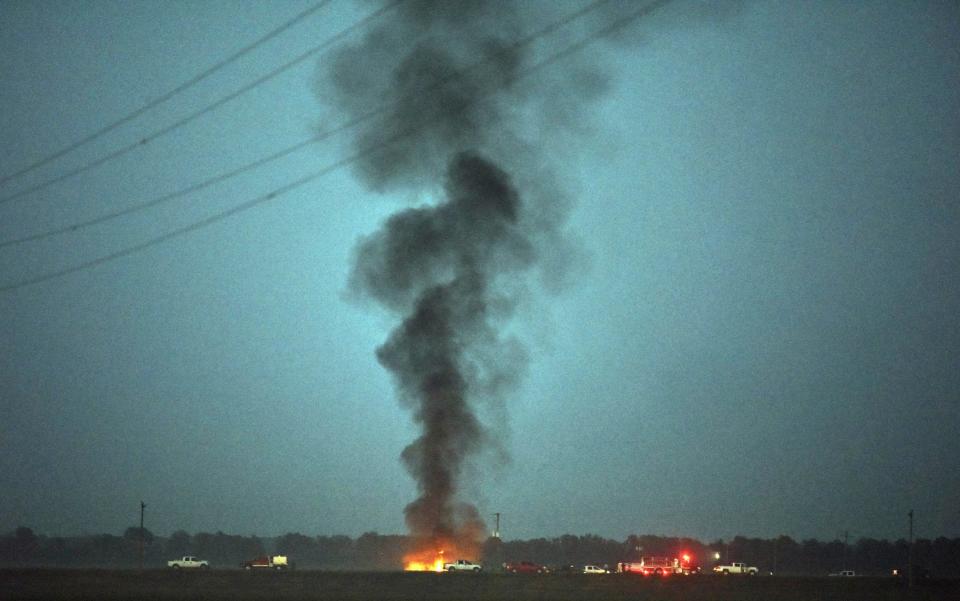 Smoke billows into the sky after the KC-130 Hercules transport aircraft crashed - Credit: Elijah Baylis/The Clarion-Ledger