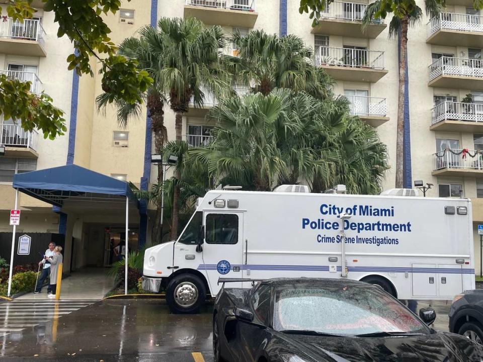 A Miami police crime scene investigations truck is parked in front of Yolanda Villas Condo, 801 NW 47th Ave., where a man shot and killed his ex and her daughter on Wednesday, Dec. 13, 2023, Miami police said.