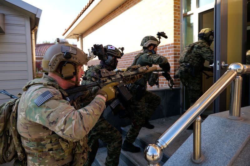 Members of South Korea and U.S. Special forces take part in a joint military exercise conducted by South Korean and U.S. special forces troops at Gunsan Air Force base in Gunsan