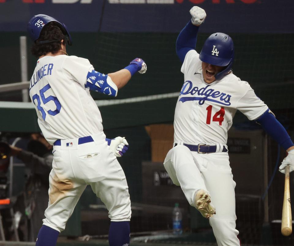 Bellinger celebrates his go-ahead home run with Kiké Hernandez in the seventh inning.