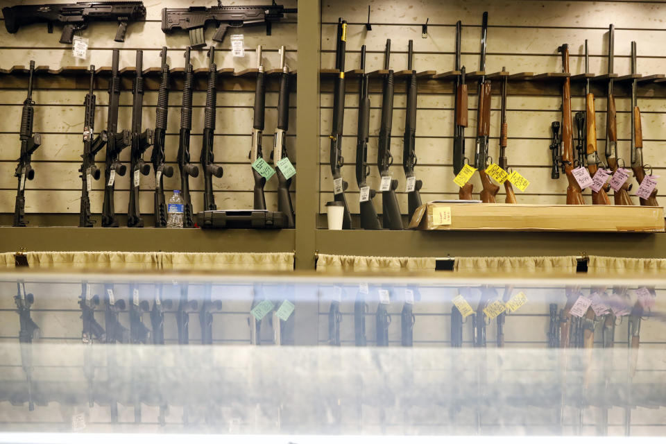 Guns are displayed in the showroom of Maxon Shooter's Supplies and Indoor Range, Friday, April 30, 2021, in Des Plaines, Ill. After a year of pandemic lockdowns, mass shootings are back, but the guns never went away. As the U.S. inches toward a post-pandemic future, guns are arguably more present in the American psyche and more deeply embedded in American discourse than ever before. The past year's anxiety and loss fueled a rise in gun ownership across political and socio-economic lines. (AP Photo/Shafkat Anowar)