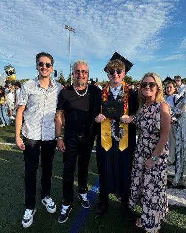 <p>Guy Fieri/Instagram</p> Hunter, Guy, Ryder and Lori Fieri pose for a family photo at Ryder's high school gradiation in June 2024