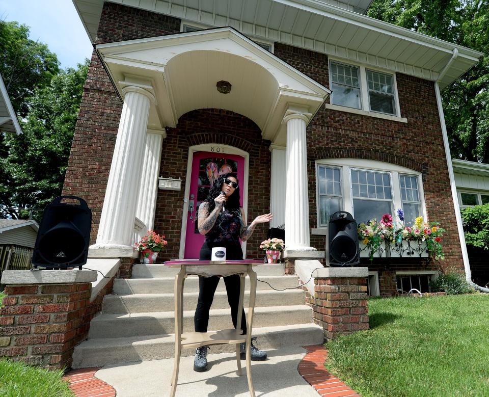 Wooden It Be Lovely staff coordinator and lead designer Megan Murray speaks during the blessing of the Wooden It Be Lovely residential house on South Grand Avenue in Springfield on Thursday June 2, 2022. Up to four women who are recovering from forms of addiction or who have experienced poverty or abuse are expected to live in the house. Murray came into the program six years ago.