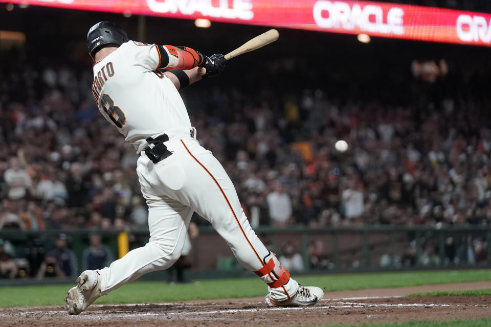 San Francisco Giants' Michael Conforto hits a two-run single against the San Diego Padres during the eighth inning of a baseball game in San Francisco, Monday, Sept. 25, 2023. (AP Photo/Jeff Chiu)