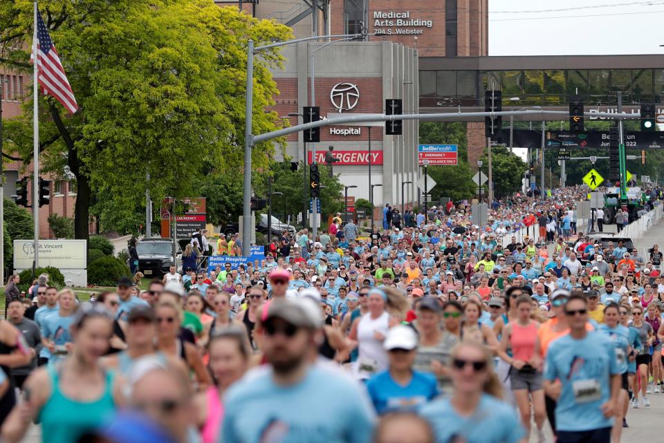 Participants run on Webster Avenue at the start of the 2022 Bellin Run last June 11 in Green Bay.