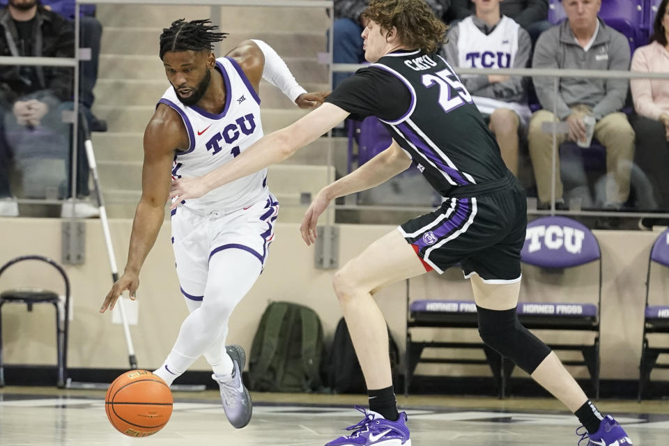 TCU guard Mike Miles Jr. (1) gets the steal against Central Arkansas guard Elias Cato (25) during the first half of an NCAA college basketball game in Fort Worth, Texas, Wednesday, Dec. 28, 2022. (AP Photo/LM Otero)
