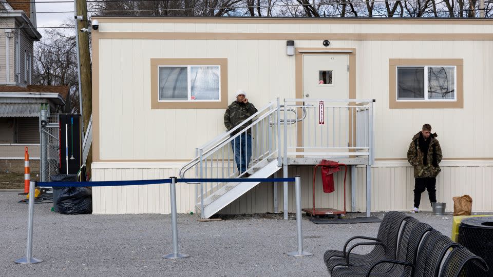 People wait outside a makeshift Greyhound bus stop in a trailer in Arlington Heights, Cincinnati, in 2023. The downtown terminal closed. - Stephanie Scarbrough/The Enquirer/USA TODAY NETWORK/Imagn