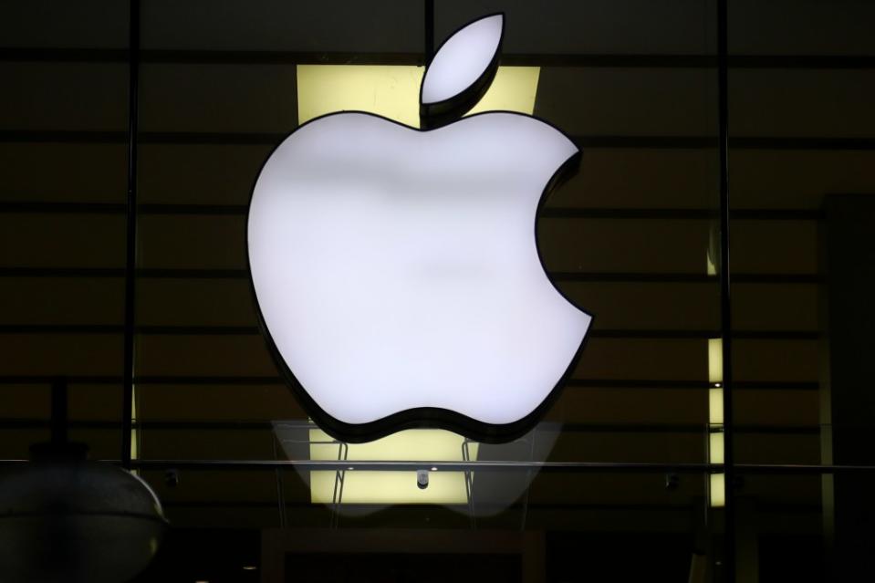 Illuminated Apple logo at a store in the city center of Munich, Germany. AP