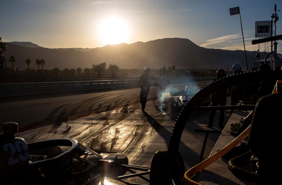A crew member sends Rinus Veekay of Ed Carpenter Racing out of the pits during pit stop practice during day two of NTT IndyCar Series open testing at The Thermal Club in Thermal, Calif., Friday, Feb. 3, 2023. 