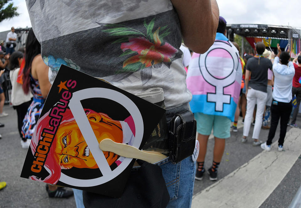 A marcher listens to speakers in Los Angeles