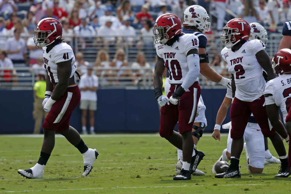 Sep 3, 2022; Oxford, Mississippi, USA; Troy defensive back Javon Solomon (41) and Troy linebacker Jayden McDonald (10) react after a tackle during the first quarter against the Mississippi Rebels at Vaught-Hemingway Stadium. Mandatory Credit: Petre Thomas-USA TODAY Sports