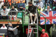 Romania's head coach Ilie Nastase talks to the chair umpire during the FedCup Group II play-off match between Romania and Great Britain, in Constanta county, Romania, April 22, 2017. Inquam Photos/George Calin/via REUTERS