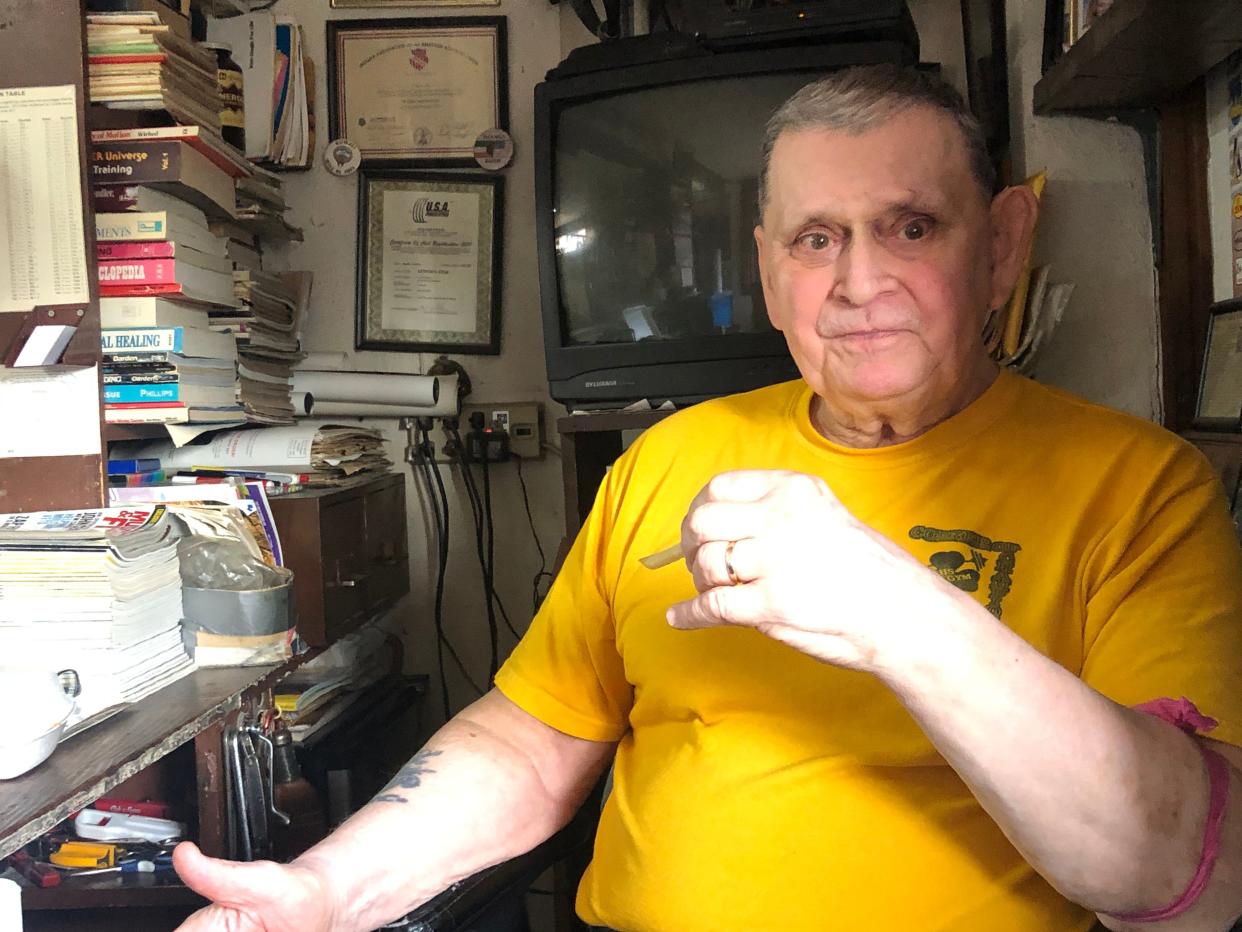 Tom Lynch watches over his gym from his desk. The gym has operated for 40 years on South Bend's westside.