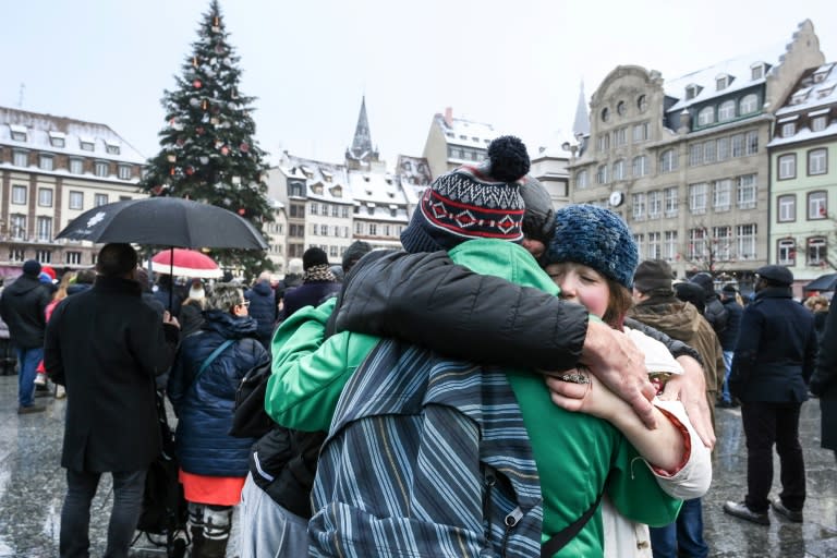 Hundreds of people gathered at the Christmas market in Strasbourg, eastern France, on Sunday to honour the victims of a gunman's shooting spree last week