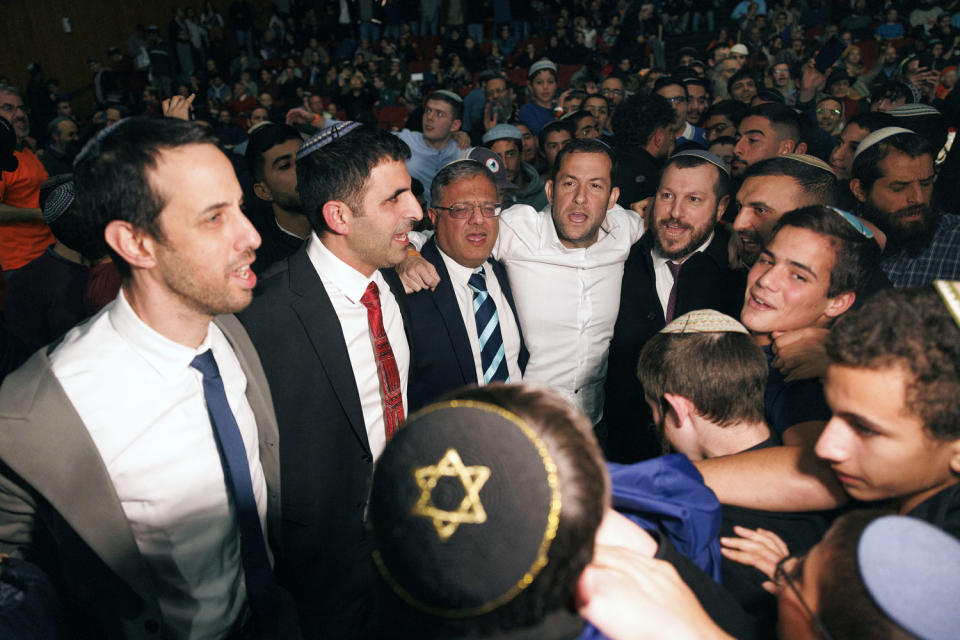 Ariel Kallner, left, Shlomo Karhi, Itamar Ben-Gvir, Yossi Dagan and Amihai Eliyahu were among the politicians dancing at the conference in Jerusalem on Sunday. (Kobi Wolf for NBC News)