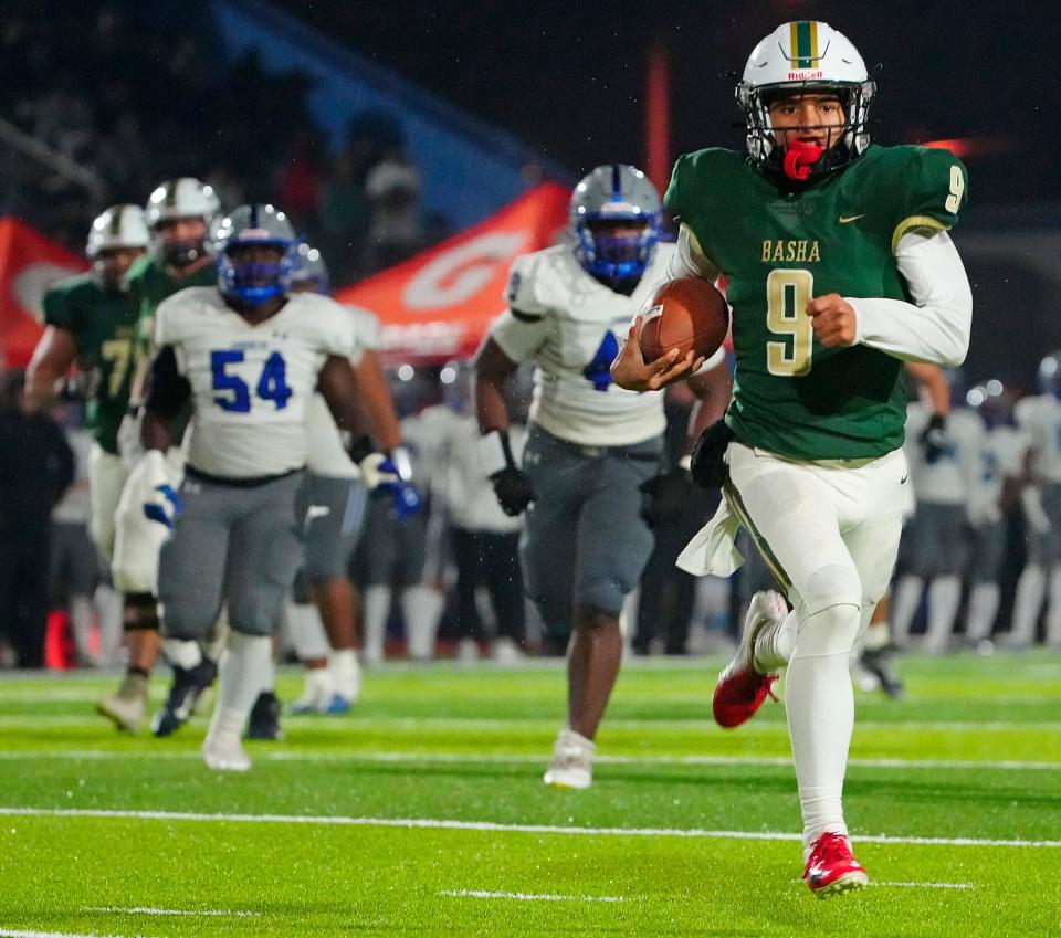 December 3, 2022; Chandler, Ariz; USA; Basha quarterback Demond Williams Jr. (9) runs for a first down against Chandler during the Open Semfinal at Dobson High School.