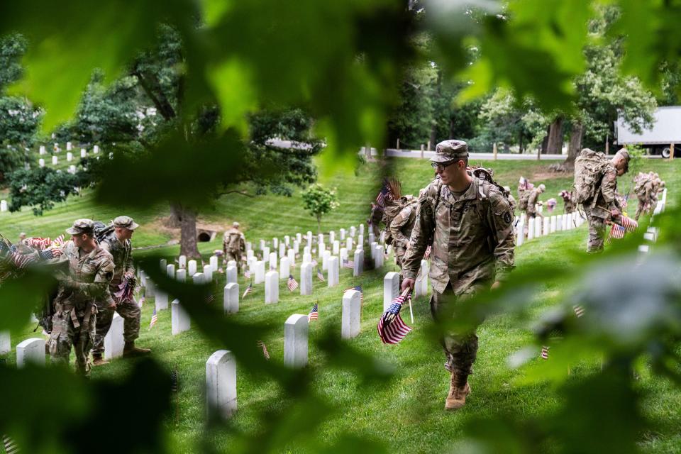 Members of the 3rd U.S. Infantry Regiment also known as “The Old Guard” take part in a joint service “Flags-In” ceremony at Arlington National Cemetery on Thursday, May 25, 2023.