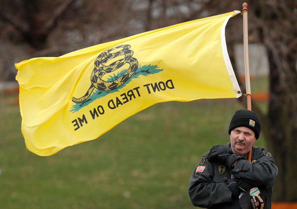 <p>A rally attendee listens to a speaker during a gun-rights rally at the state capitol, Saturday, April 14, 2018, in Des Moines, Iowa. About 100 gun rights supporters gathered for one of dozens of rallies planned at statehouses across the U.S. (Photo: Charlie Neibergall/AP) </p>