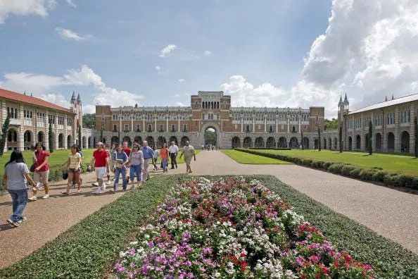 New students and their parents walk outside Lovett Hall during an orientation tour on the campus of Rice University in Houston in this 2009 file photo. Mainstays like orientation are in doubt as colleges across the country try to figure out if it is safe to have in-person classes this fall.