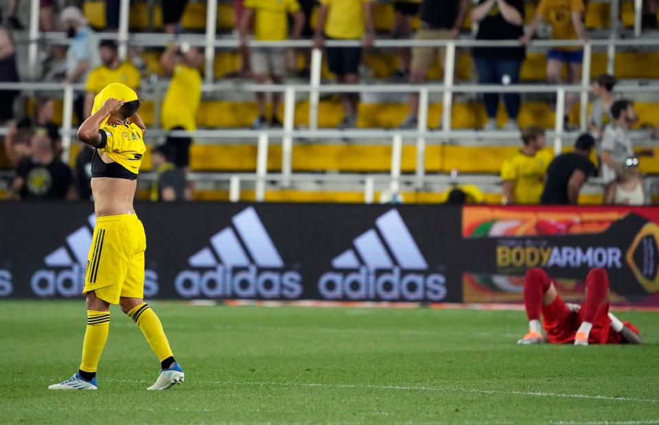 Aug 3, 2022; Columbus, Ohio, USA; Columbus Crew forward Pedro Santos (7) puts his jersey over his head and goalkeeper Eloy Room (1) lays on the ground after losing 2-1 to CF Montreal during their MLS game at Lower.com Field in Columbus, Ohio on August 3, 2022. 