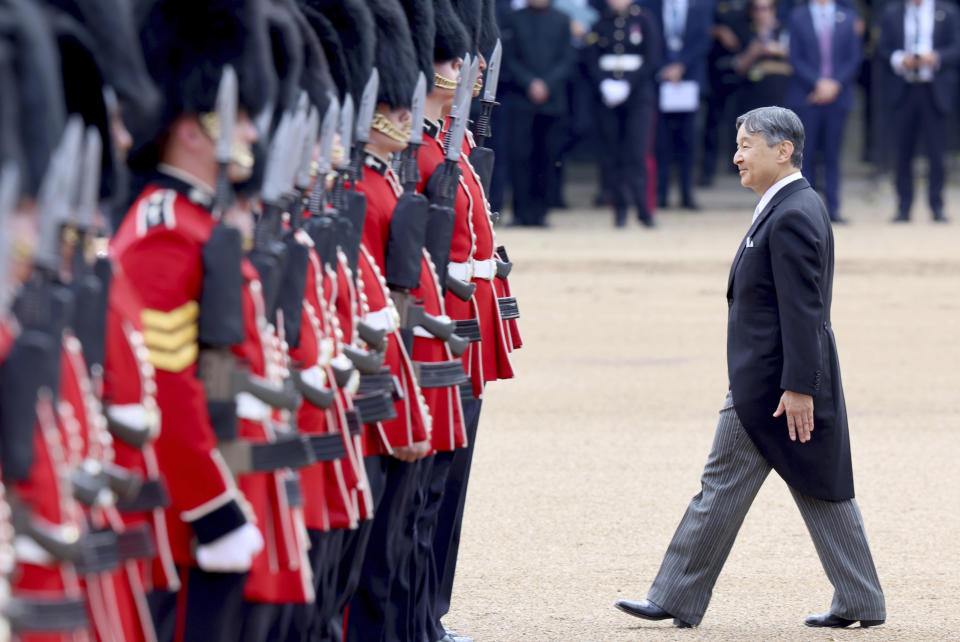 Emperor Naruhito of Japan inspects the Guard of Honour formed of the 1st Battalion Welsh Guards during a ceremonial welcome for him and Empress Masako on the occasion of their state visit to Britain, at Horse Guards Parade, London, Tuesday, June 25, 2024. (Chris Jackson/Pool Photo via AP)