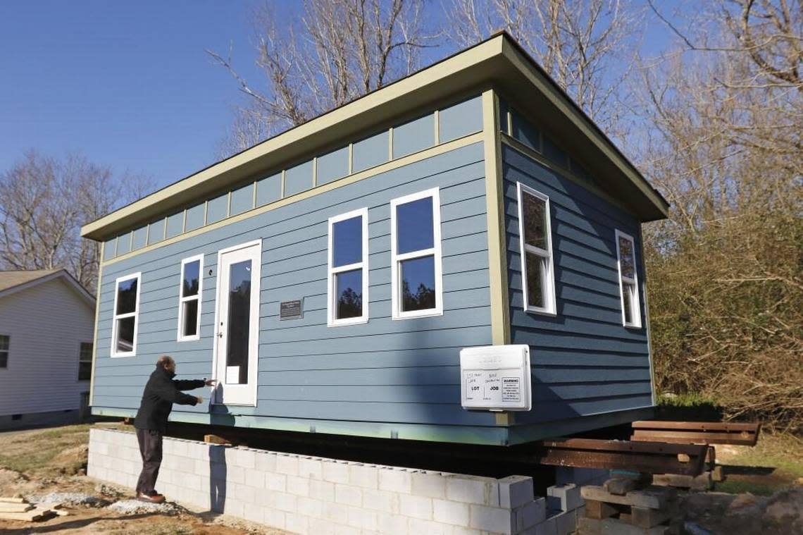 Thava Mahadevan, Director of Operations for UNC’s Center for Excellence in Community Mental Health is excited to show visitors the first project tiny house, a 12 foot x 28 foot one-story house at The Farm on Penny Lane in Chatham County. The 336 square foot house is the pilot house, the first of several where clients with mental illness will be able to live inexpensively in a planned tiny house community for people with mental illnesses just south of Chapel Hill.