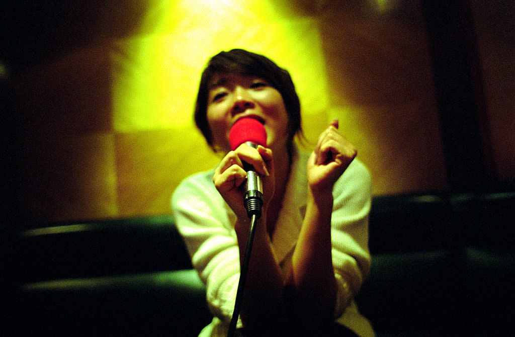 Woman Sings Karaoke