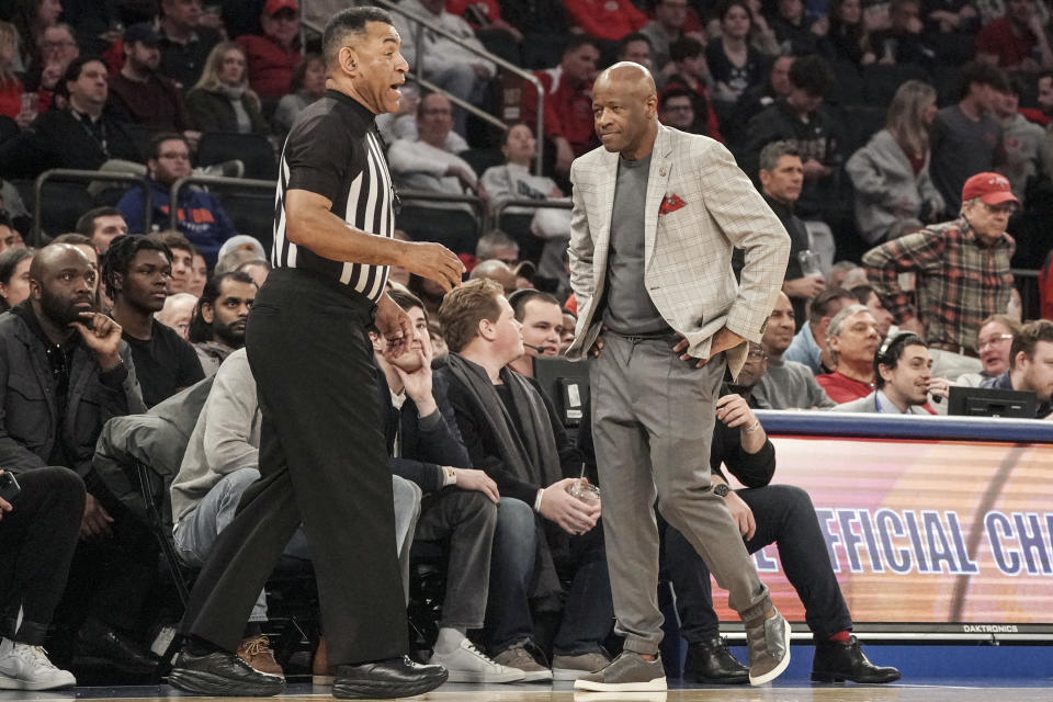 St. John's coach Mike Anderson, right, walks back to his bench after getting called for a technical foul during the second half of an NCAA college basketball game against UConn, Saturday, Feb. 25, 2023, in New York. (AP Photo/Bebeto Matthews)