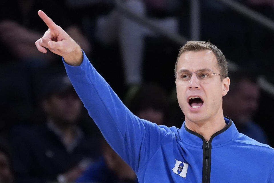 Duke head coach Jon Scheyer works the bench during the second half of the team's NCAA college basketball game against Iowa in the Jimmy V Classic, Tuesday, Dec. 6, 2022, in New York. (AP Photo/John Minchillo)