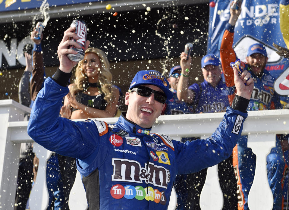 Kyle Busch celebrates in Victory Lane after winning a NASCAR Cup Series auto race, Sunday, July 29, 2018, in Long Pond, Pa. (AP Photo/Derik Hamilton)