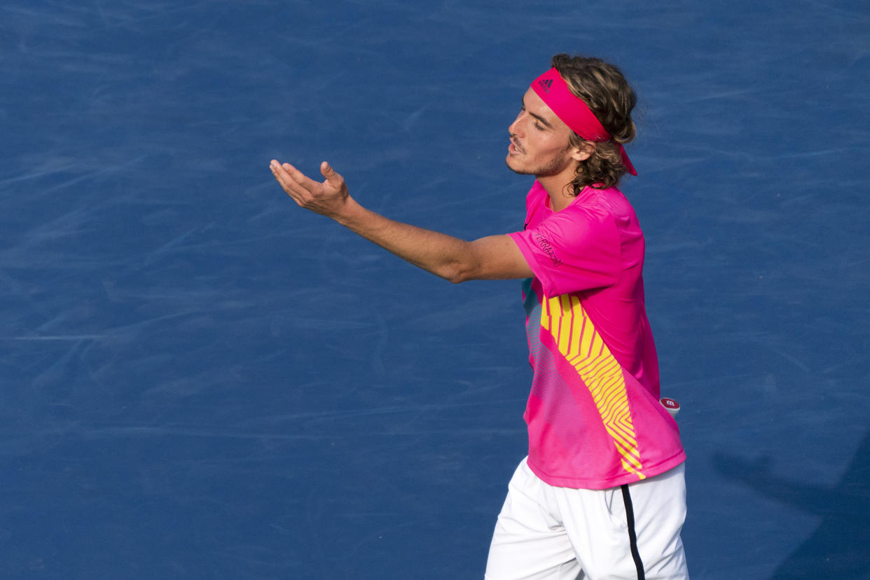 The Greek youngster argues with the chair umpire after the serve went wide