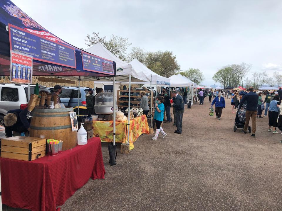 Shoppers check out the stalls at the Burlington Farmers Market on Pine Street in Burlington on the market's opening day for the year, Saturday, May 8, 2021.