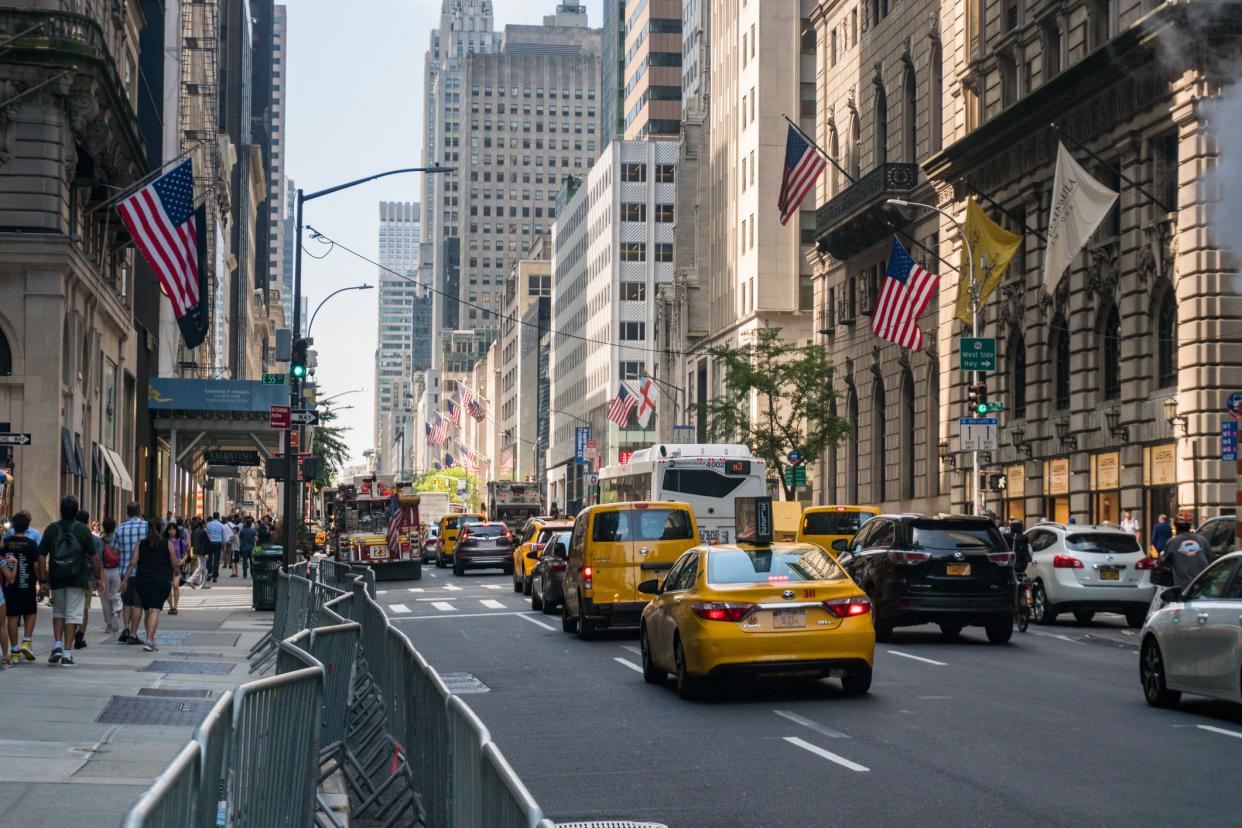 New York City, USA - August 8, 2019:Taxy on Fifth Avenue in front of St. Patrick's Cathedral during a sunny day