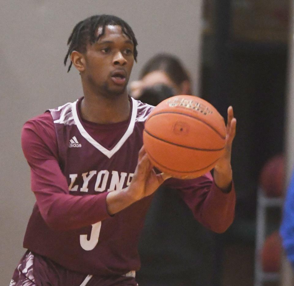 JC Walker of Lyons passes the ball.