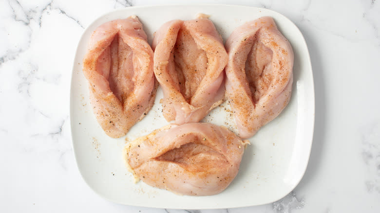 seasoned chicken breasts on plate