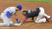 Sep 14, 2017; Cleveland, OH, USA; Cleveland Indians third baseman Jose Ramirez (11) is tagged out by Kansas City Royals second baseman Whit Merrifield (15) after he slid past the base on an attempted steal in the sixth inning at Progressive Field. Mandatory Credit: David Richard-USA TODAY Sports