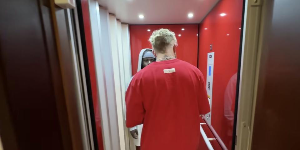 Jake Paul entering an elevator.