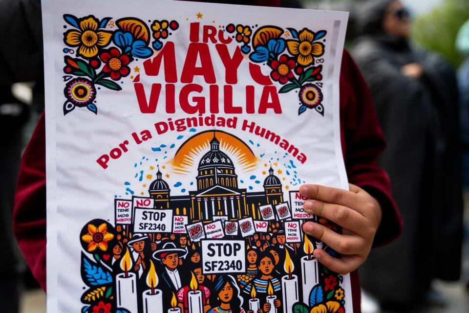 The group Latinx Immigrants of Iowa demonstrates in opposition to the state's new "illegal reentry" law Wednesday, May 1, 2024, outside the Iowa State Capitol. This demonstration was one of four similar ones held across the state.