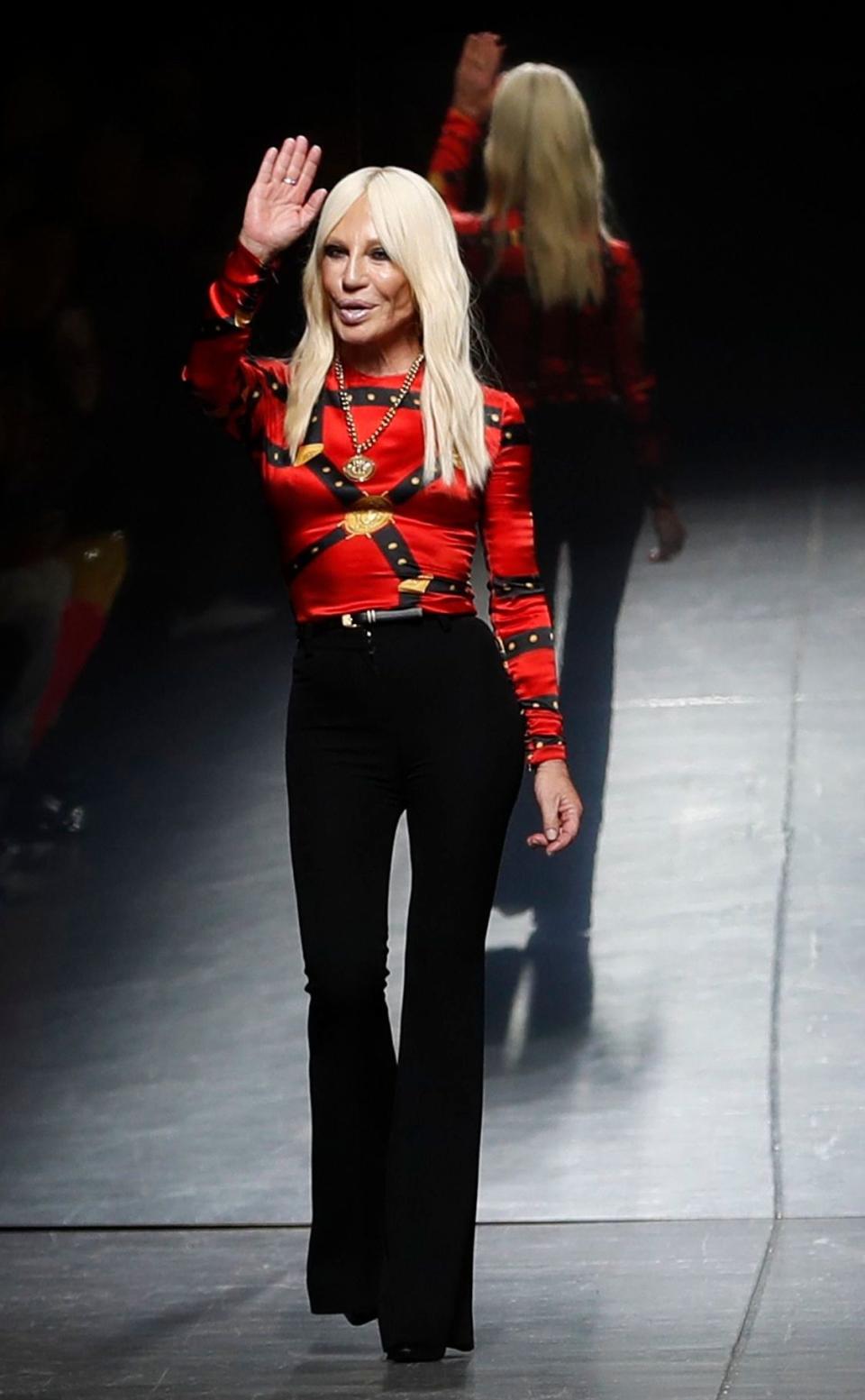 Donatella Versace acknowledges the audience's applause at the end of her men's Fall-Winter 2019-20 collection, that was presented in Milan, Italy, Saturday, Jan.12, 2019Fashion Versace, Milan, Italy - 12 Jan 2019