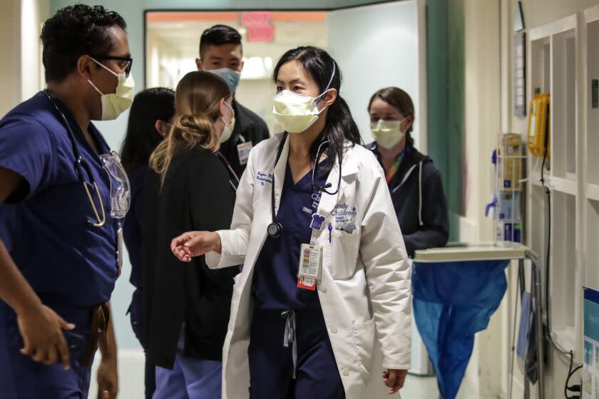 San Diego, CA - January 19: Doctors huddle in COVID19 unit at Rady Children's Hospital on Wednesday, Jan. 19, 2022 in San Diego, CA. (Irfan Khan / Irfan Khan)