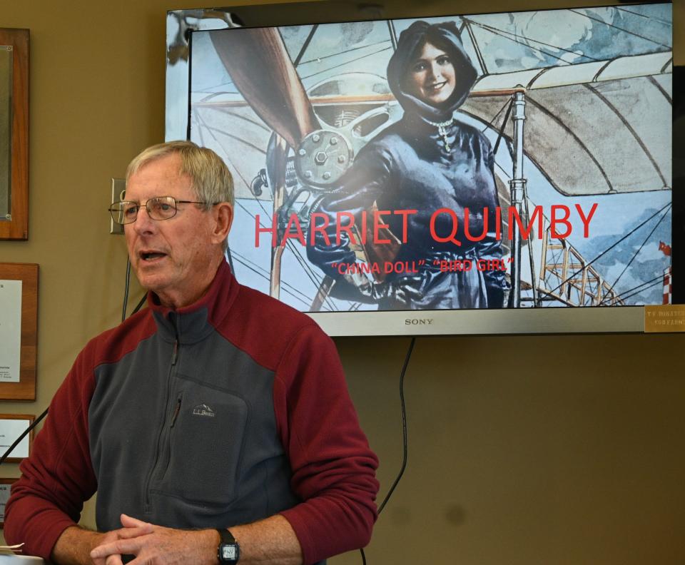 Flying club and airport board member John Van Dam welcomed those who attended the Sunday unveiling of the Quimby flight suit.